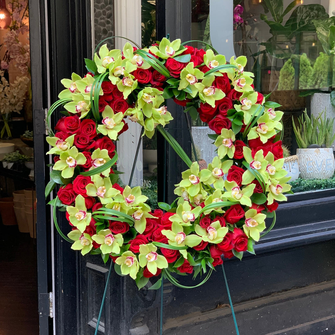 red rose and green flower standing spray